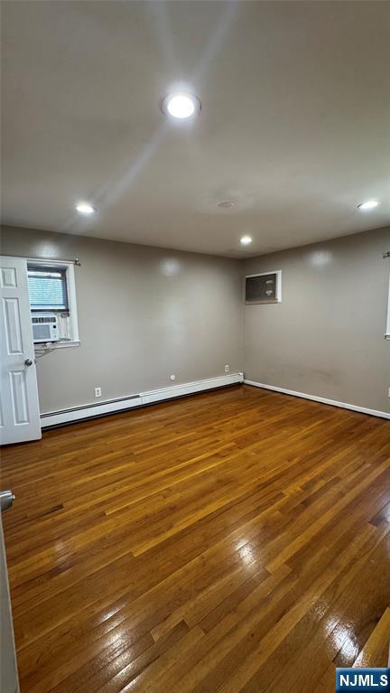 85 Eastern Way Rutherford, NJ 07070 - Photo 12 of 23 an empty room with wooden floor and windows