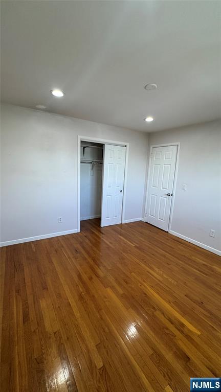 85 Eastern Way Rutherford, NJ 07070 - Photo 19 of 23 an empty room with wooden floor and natural light