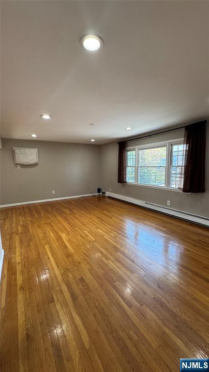 85 Eastern Way Rutherford, NJ 07070 - Photo 4 of 23 an empty room with wooden floor and windows