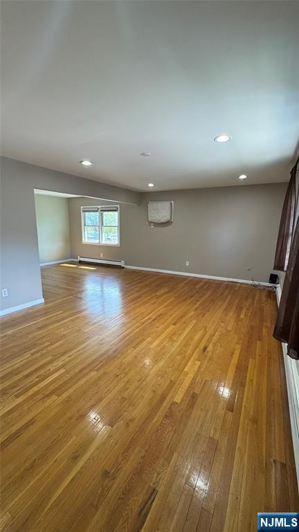 85 Eastern Way Rutherford, NJ 07070 - Photo 5 of 23 an empty room with wooden floor and windows
