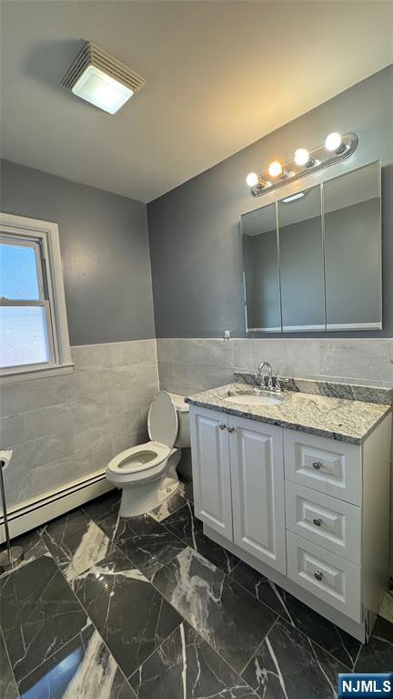 85 Eastern Way Rutherford, NJ 07070 - Photo 9 of 23 a bathroom with a granite countertop sink and a toilet