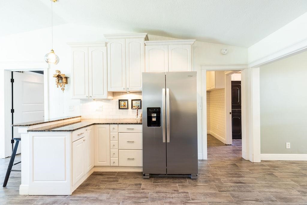 112 Drake Road St. Augustine, FL 32086 - Photo 14 of 59 a kitchen with stainless steel appliances granite countertop a refrigerator and a stove