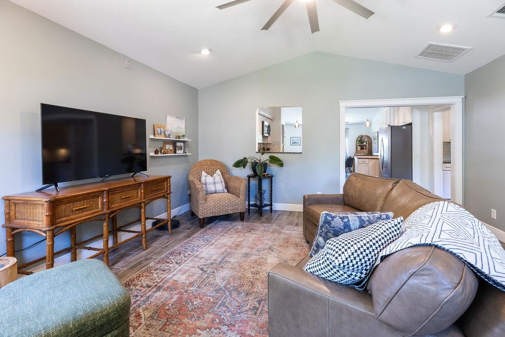 112 Drake Road St. Augustine, FL 32086 - Photo 20 of 59 a living room with furniture and a flat screen tv