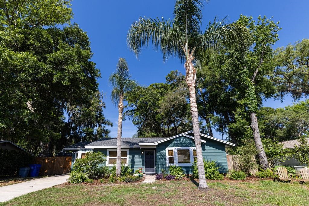 112 Drake Road St. Augustine, FL 32086 - Photo 2 of 59 a front view of a house with a yard and potted plants