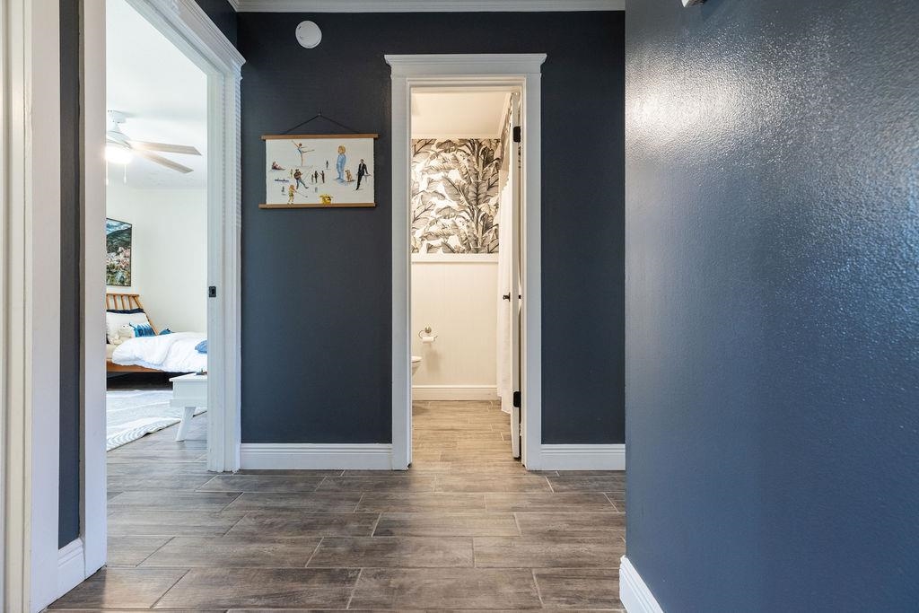 112 Drake Road St. Augustine, FL 32086 - Photo 33 of 59 a view of a hallway with wooden floor and a bedroom