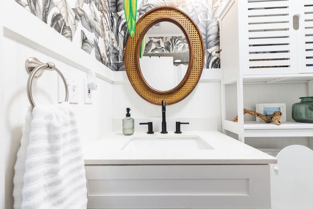 112 Drake Road St. Augustine, FL 32086 - Photo 40 of 59 a bathroom with a sink and a mirror