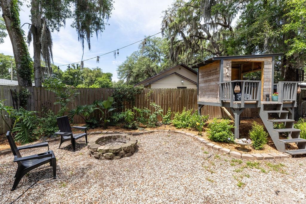 112 Drake Road St. Augustine, FL 32086 - Photo 45 of 59 a view of a chair and table in backyard of the house