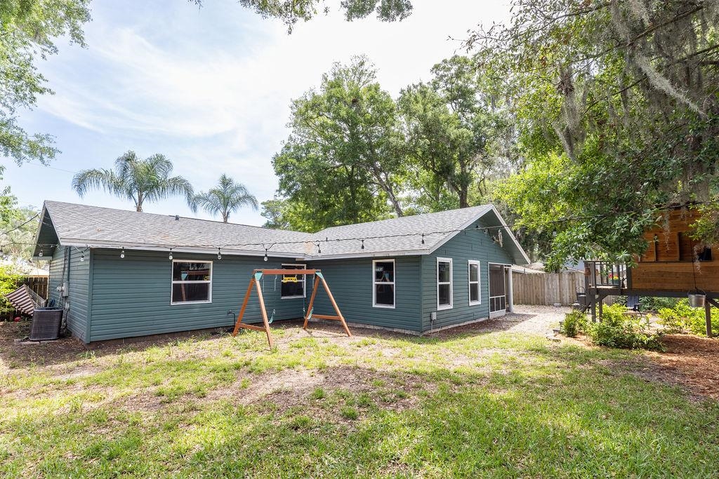 112 Drake Road St. Augustine, FL 32086 - Photo 49 of 59 a front view of a house with a garden