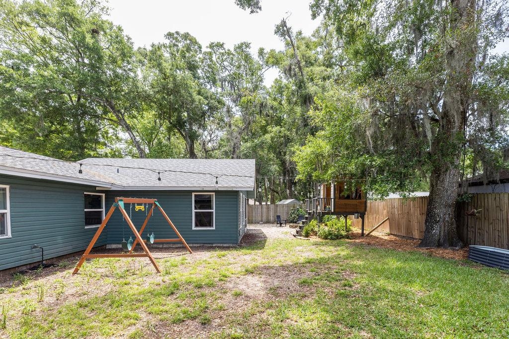 112 Drake Road St. Augustine, FL 32086 - Photo 52 of 59 a view of a house with backyard and a tree