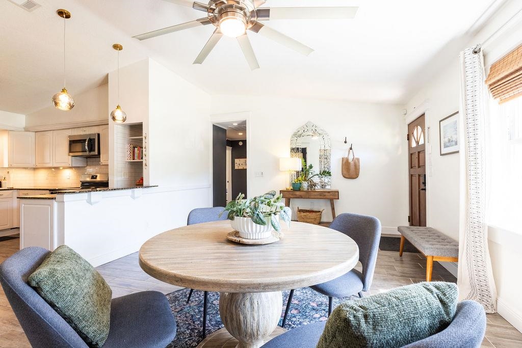 112 Drake Road St. Augustine, FL 32086 - Photo 6 of 59 a view of a dining room with furniture and wooden floor