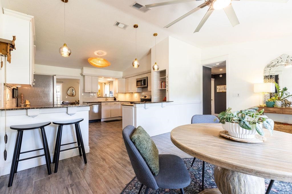 112 Drake Road St. Augustine, FL 32086 - Photo 7 of 59 a view of a dining room with furniture and wooden floor