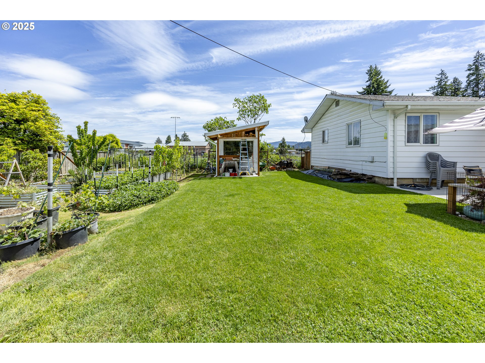 990 Barber Drive Creswell, OR 97426 - Photo 37 of 43 a backyard of a house with table and chairs