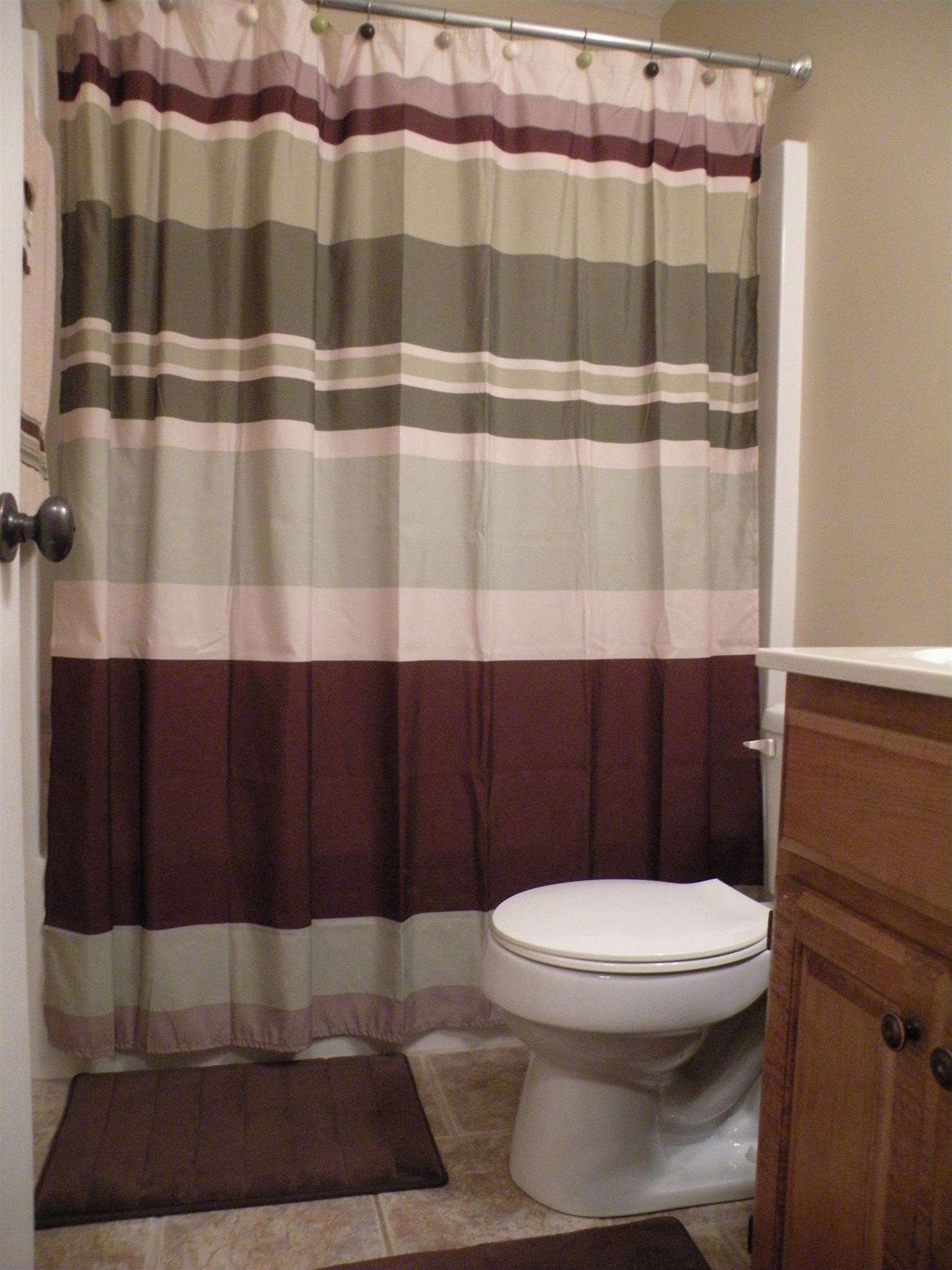 110 Harper Road Portland, TN 37148 - Photo 16 of 27 a bathroom with a toilet and a shower