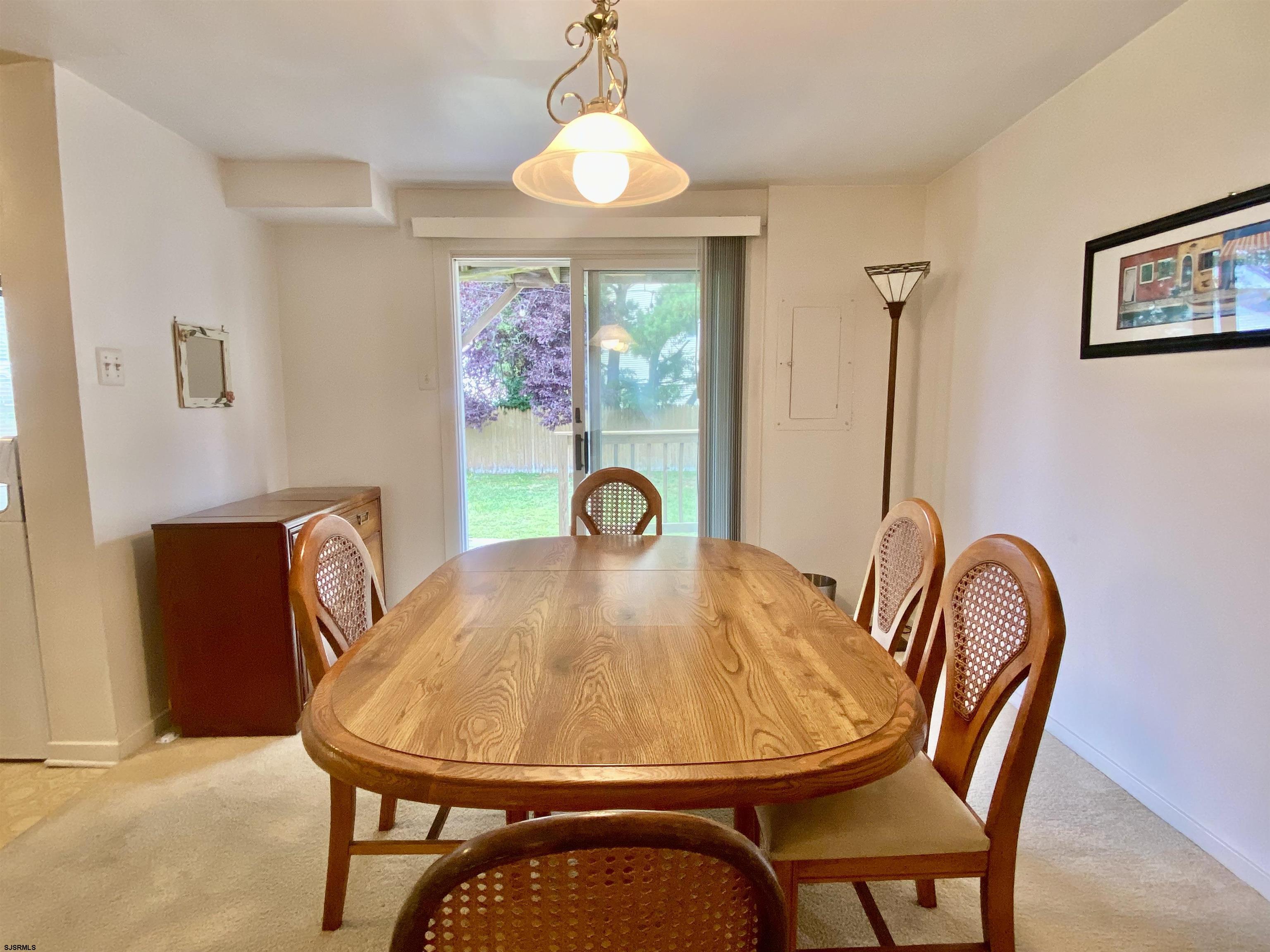 4 Ontario Drive, Unit B Brigantine, NJ 08203 - Photo 11 of 25 a view of a dining room with furniture and window