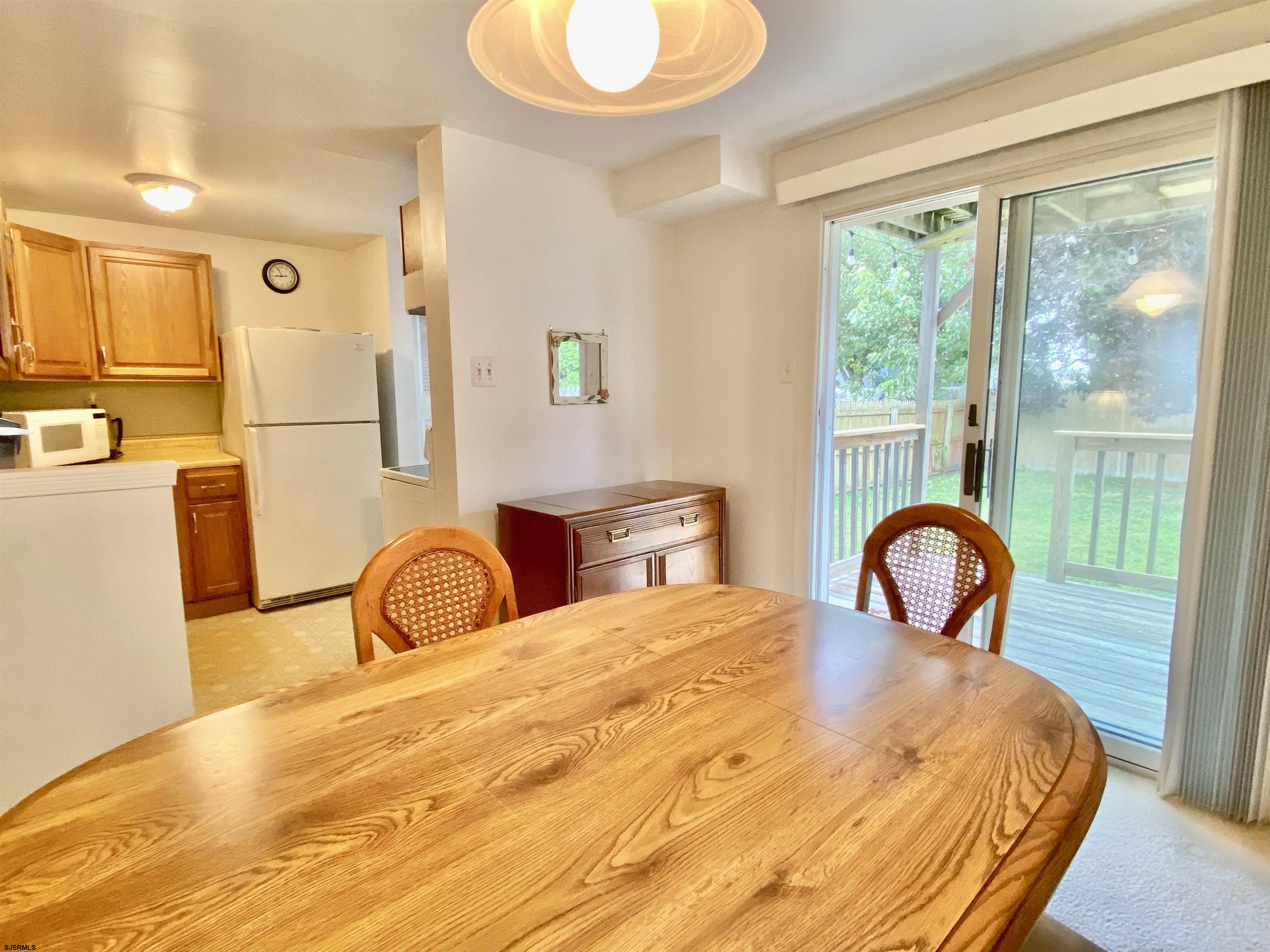 4 Ontario Drive, Unit B Brigantine, NJ 08203 - Photo 13 of 25 a bedroom with a bed and a large window