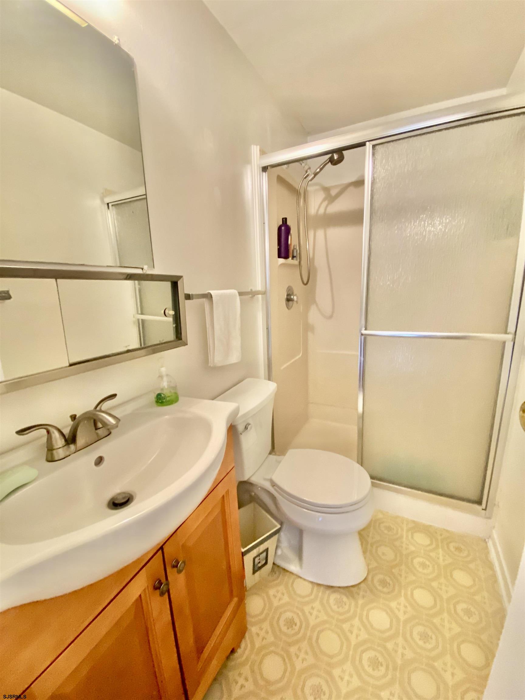 4 Ontario Drive, Unit B Brigantine, NJ 08203 - Photo 19 of 25 a bathroom with a sink toilet and shower