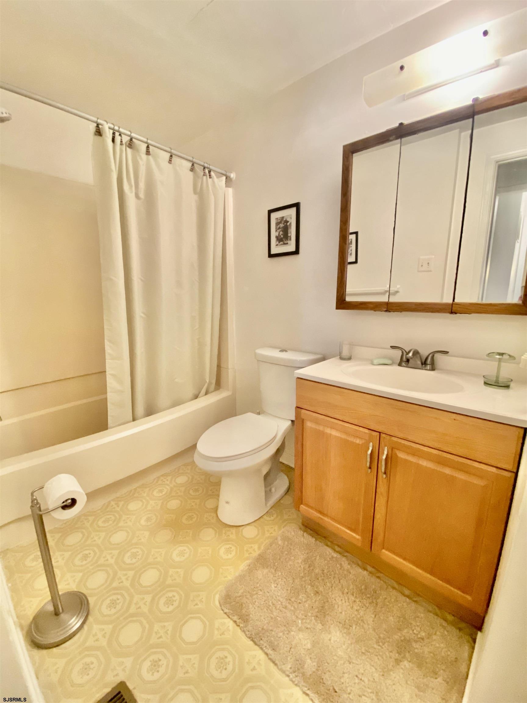 4 Ontario Drive, Unit B Brigantine, NJ 08203 - Photo 23 of 25 a bathroom with a sink a toilet and shower