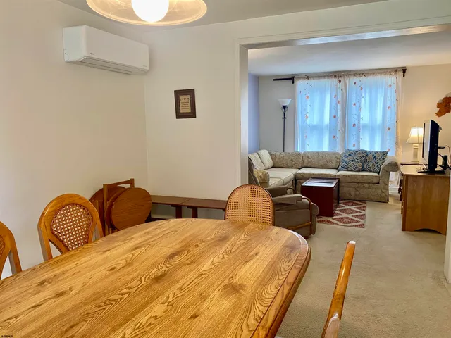 a bedroom with furniture and a potted plant