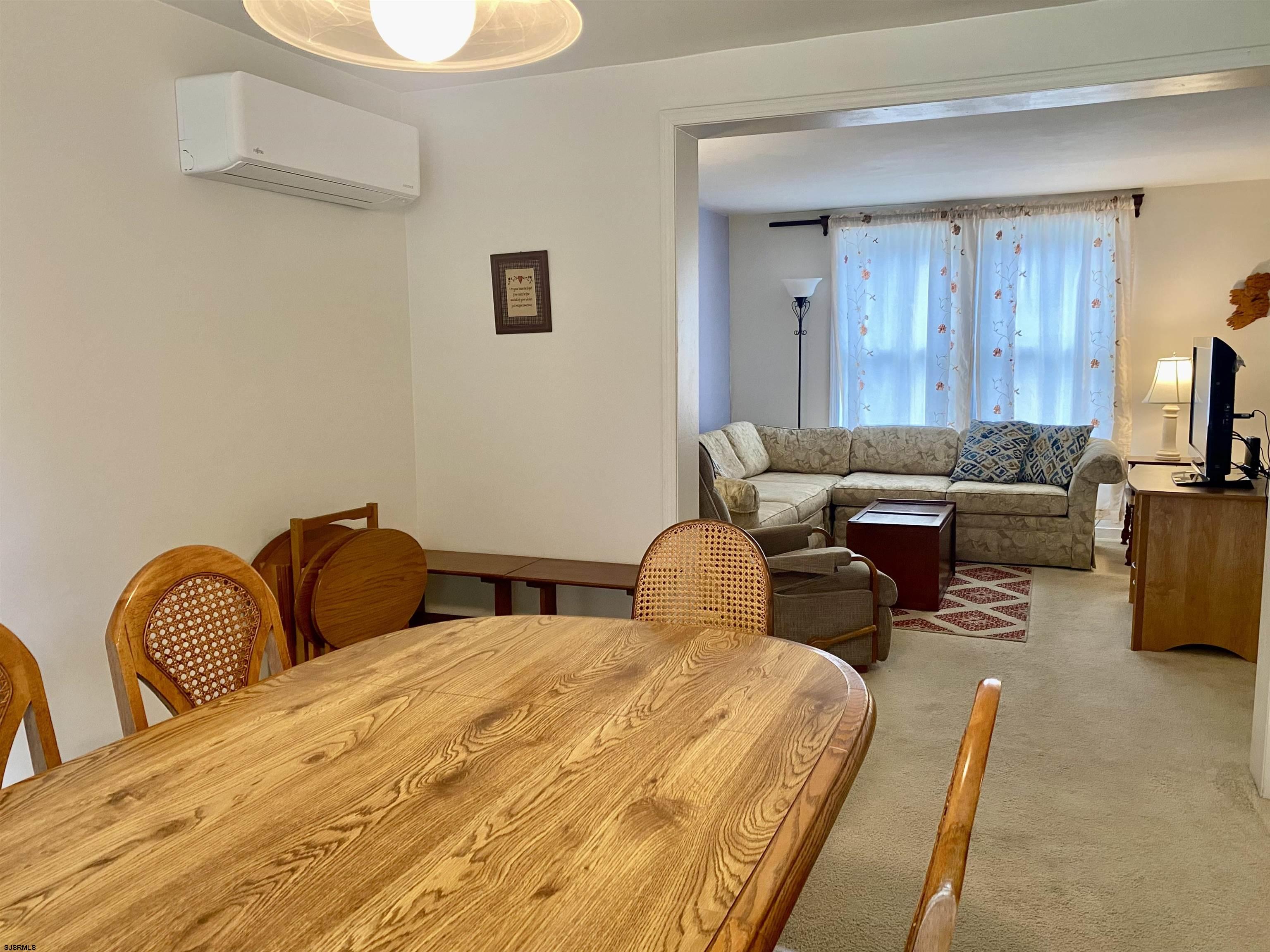4 Ontario Drive, Unit B Brigantine, NJ 08203 - Photo 10 of 25 a bedroom with furniture and a potted plant