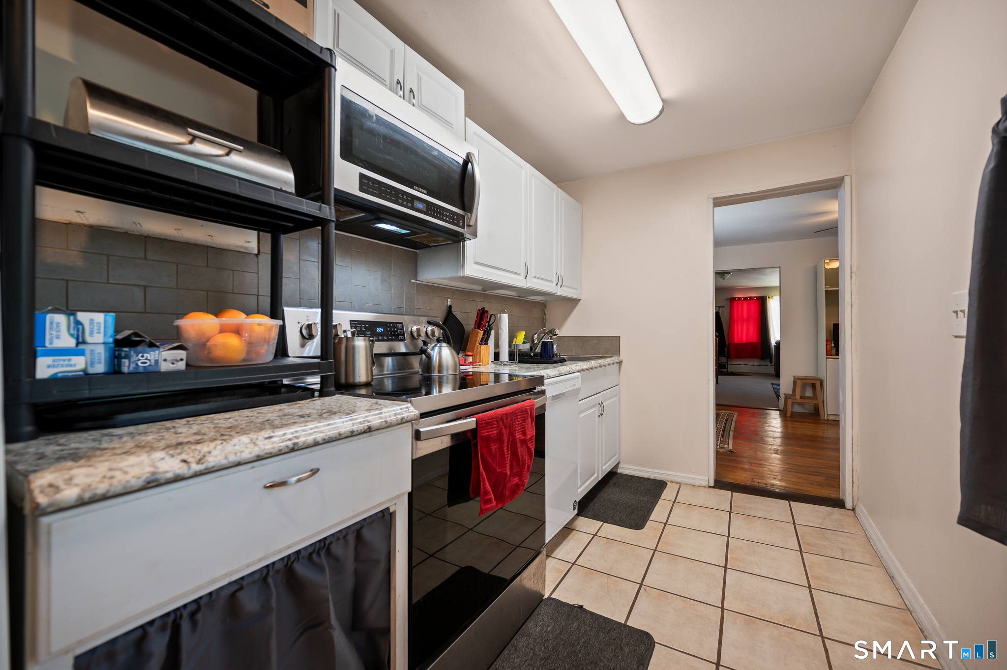 3 Flower Street Middletown, CT 06457 - Photo 8 of 17 a kitchen with stainless steel appliances granite countertop a stove and cabinets
