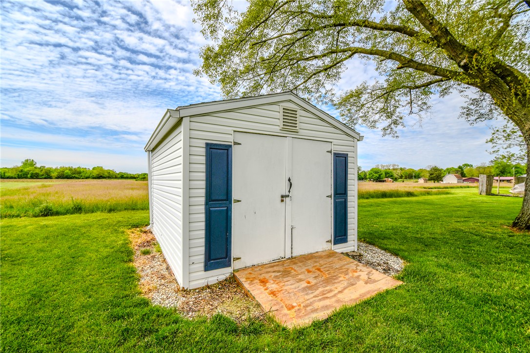 10833 Kendig Road Medway, OH 45341 - Photo 45 of 46 This charming utility shed offers practical storage amidst a lush, expansive landscape.