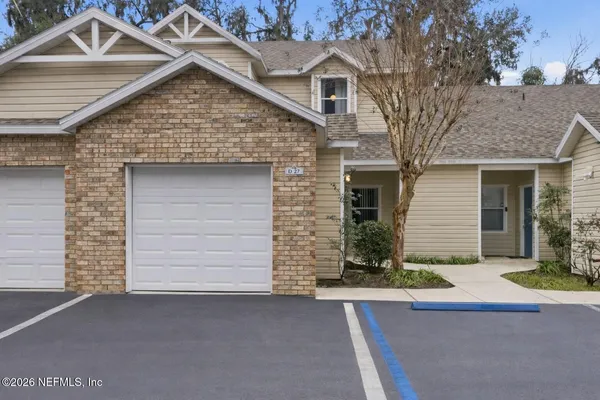 a front view of a house with a garage