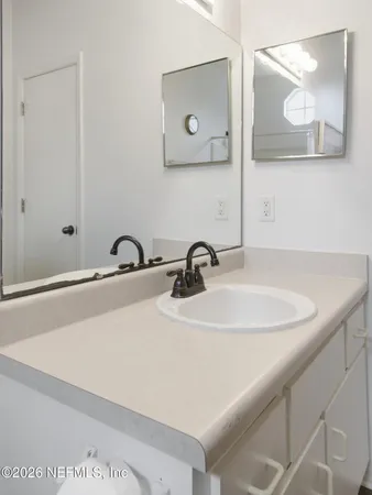 an empty room with a bathroom