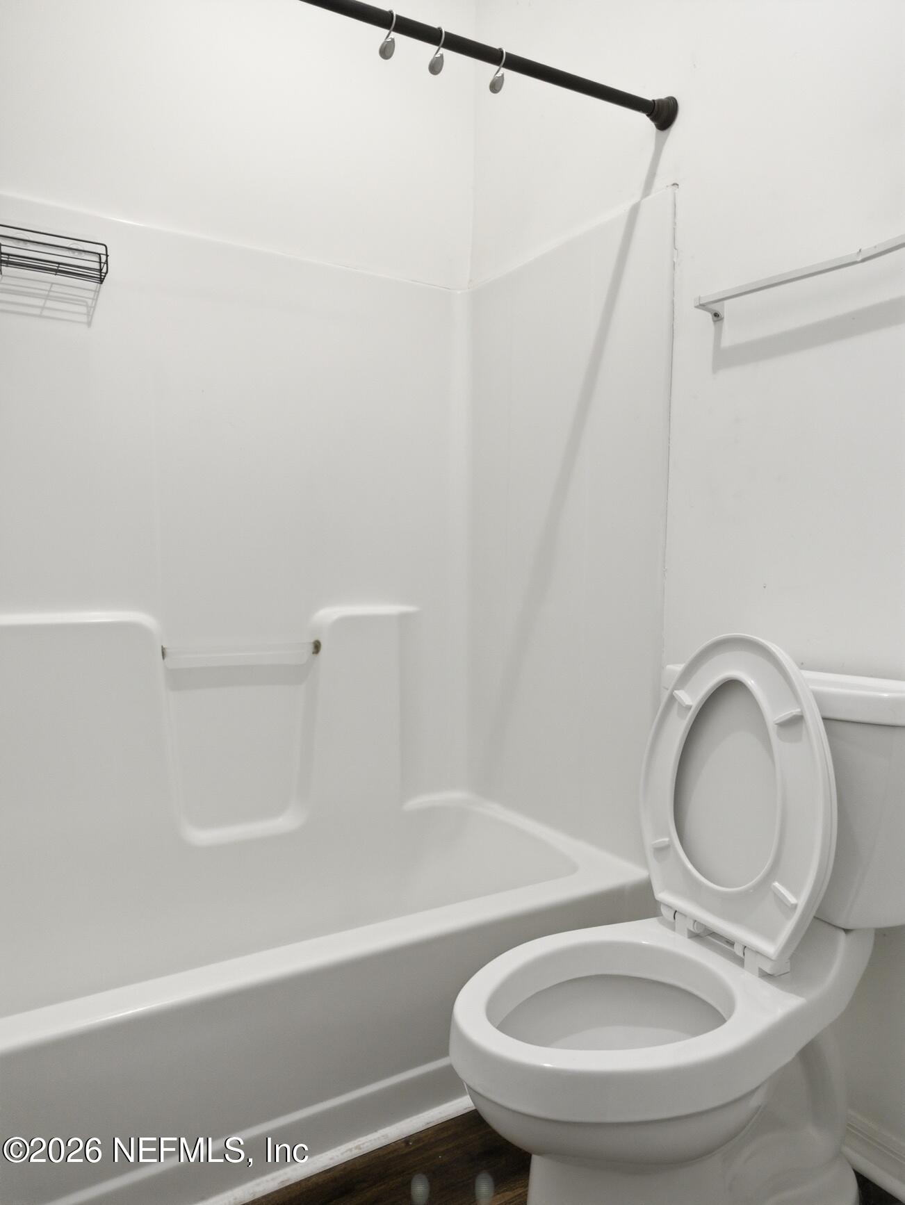 4700 Southwest Archer Road, Unit D27 Gainesville, FL 32608 - Photo 26 of 34 a bathroom with a sink a toilet and a mirror