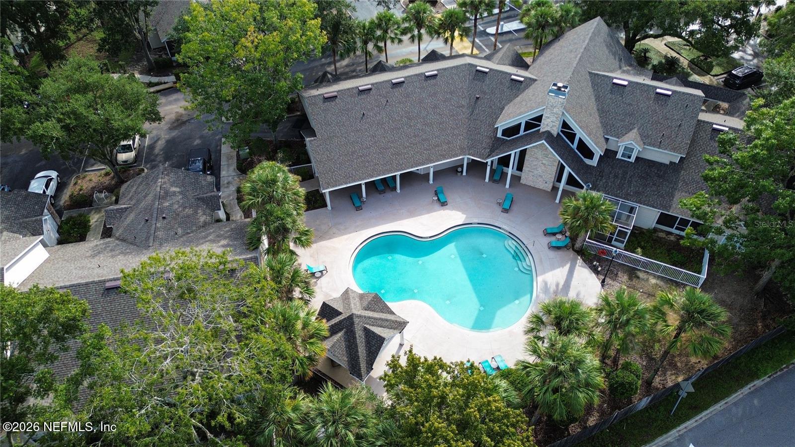 4700 Southwest Archer Road, Unit D27 Gainesville, FL 32608 - Photo 29 of 34 an aerial view of a house with swimming pool and garden