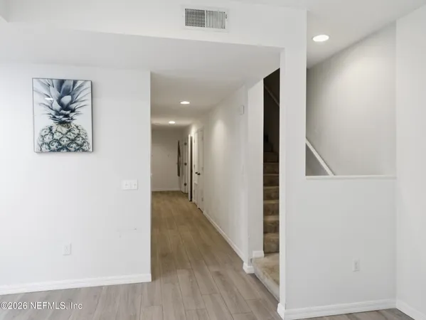 a view of hallway with stairs