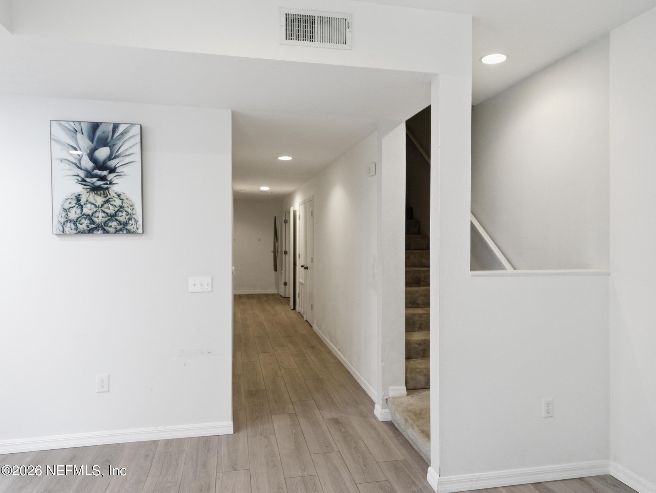 4700 Southwest Archer Road, Unit D27 Gainesville, FL 32608 - Photo 3 of 34 a view of hallway with stairs