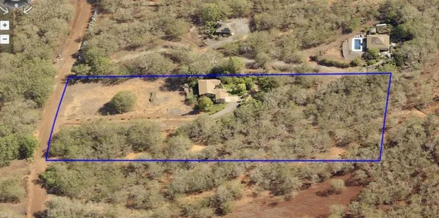 a kitchen with stainless steel appliances granite countertop a refrigerator a sink and chairs