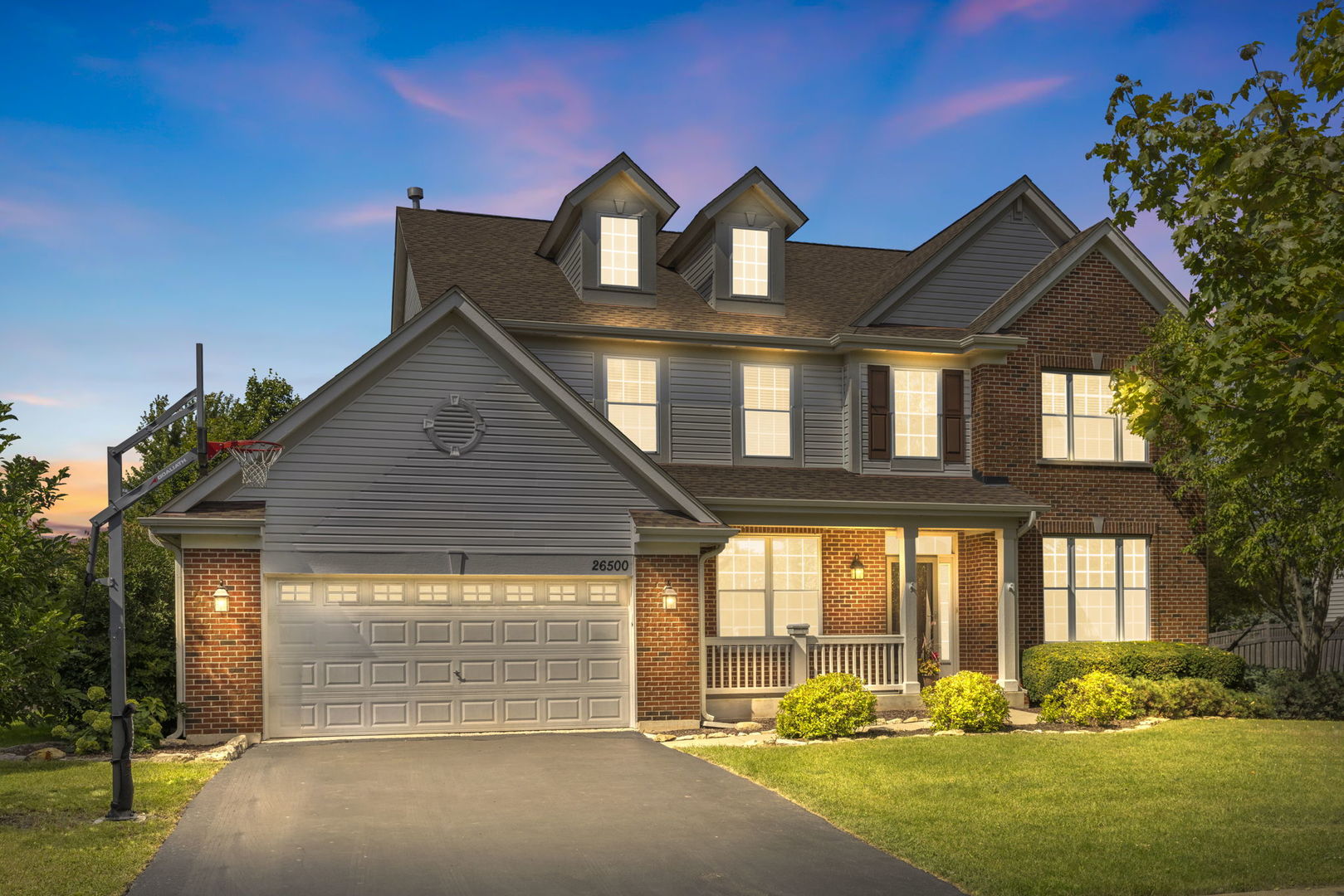 a front view of a house with a yard