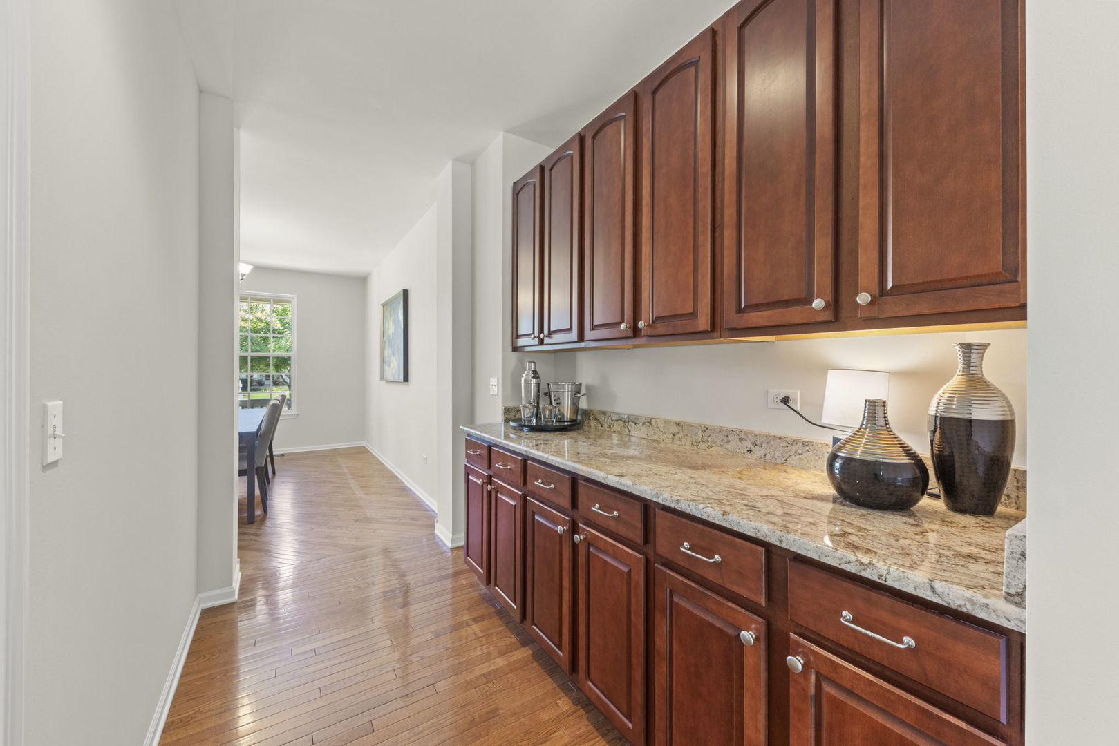 26500 Rustling Birch Way Plainfield, IL 60585 - Photo 13 of 37 a kitchen with granite countertop wooden cabinets a sink and dishwasher