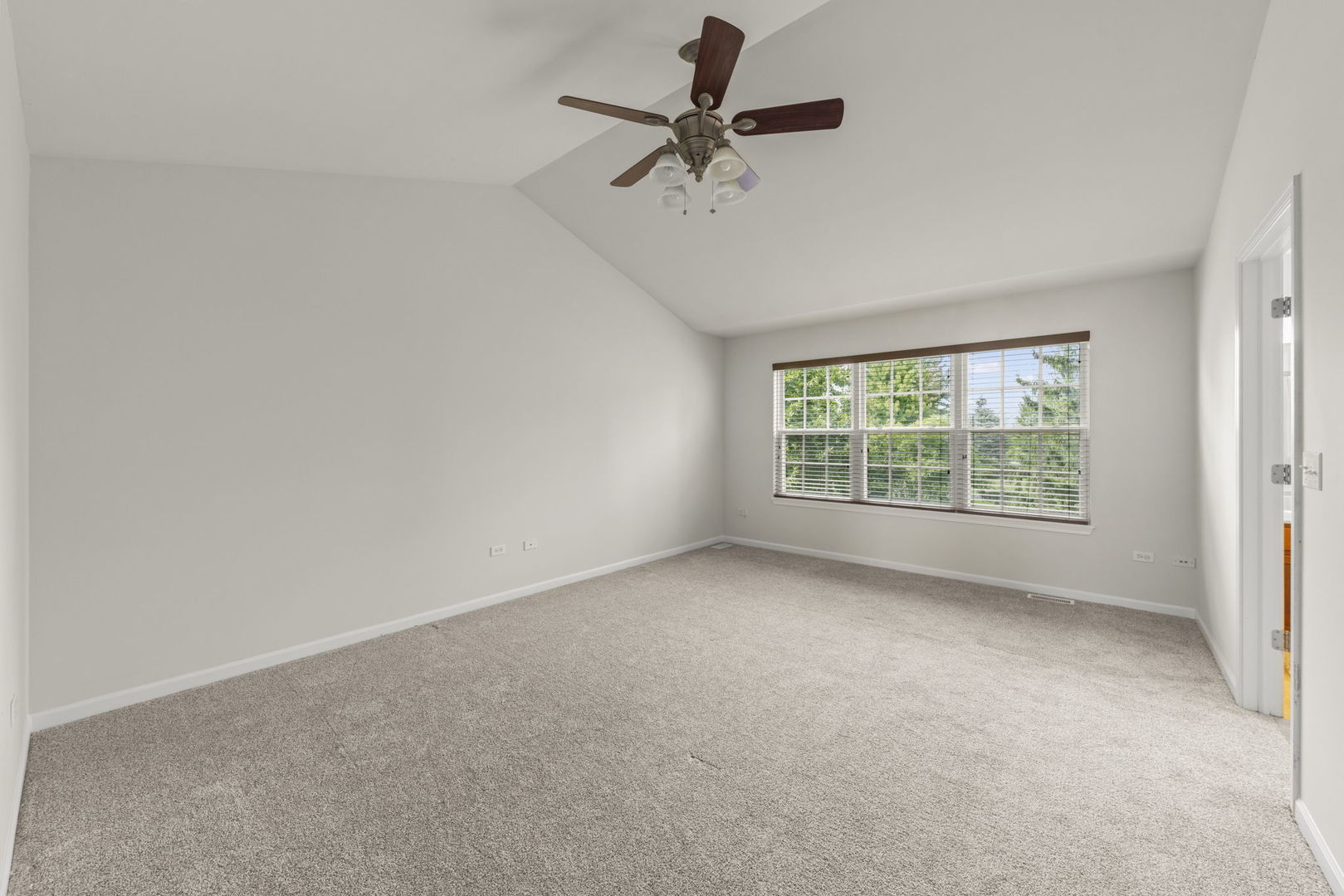 26500 Rustling Birch Way Plainfield, IL 60585 - Photo 19 of 37 an empty room with a window and a fan