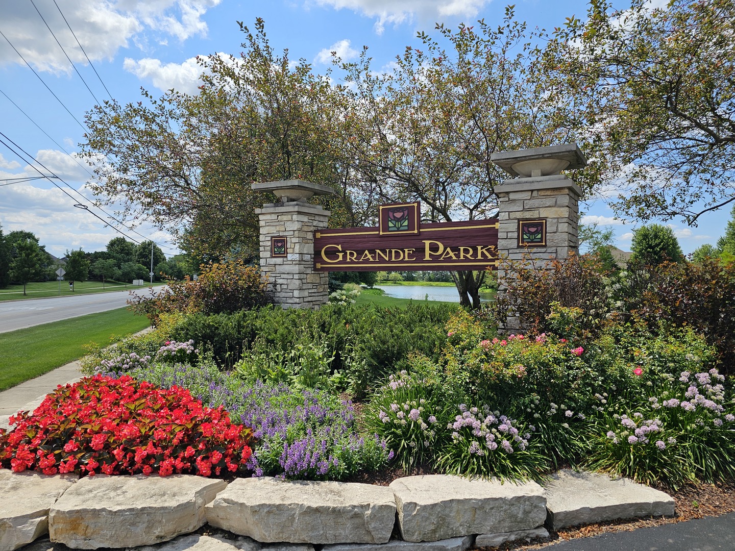26500 Rustling Birch Way Plainfield, IL 60585 - Photo 36 of 37 a view of a sign board with flower plants