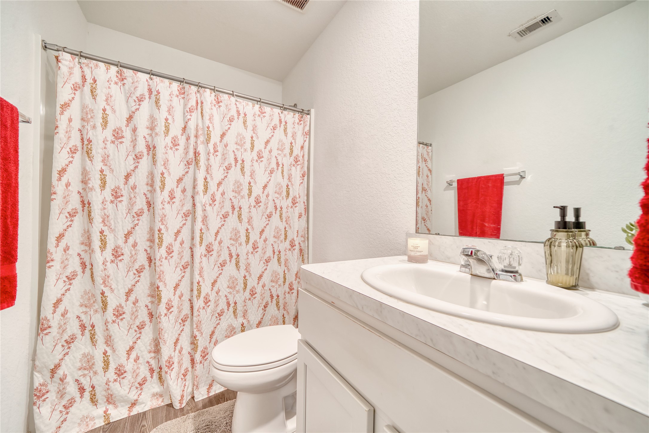 184 Kelly Street Angleton, TX 77515 - Photo 14 of 19 Clean, bright, and ready for use! This full upstairs bath offers a functional layout with crisp white cabinetry and ample lighting.