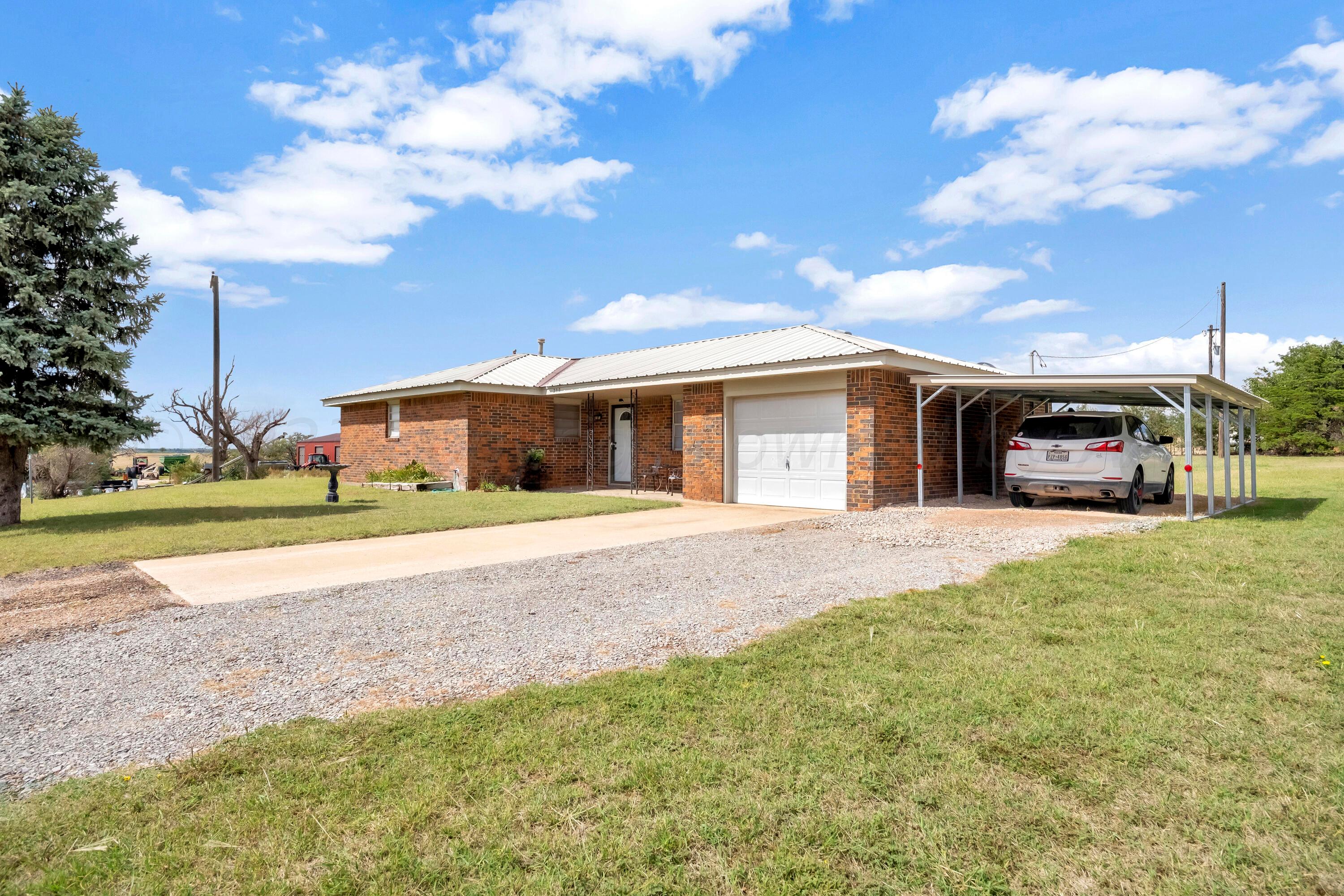 200 West Santa Fe Street Allison, TX 79003 - Photo 2 of 32 a front view of a house with a yard