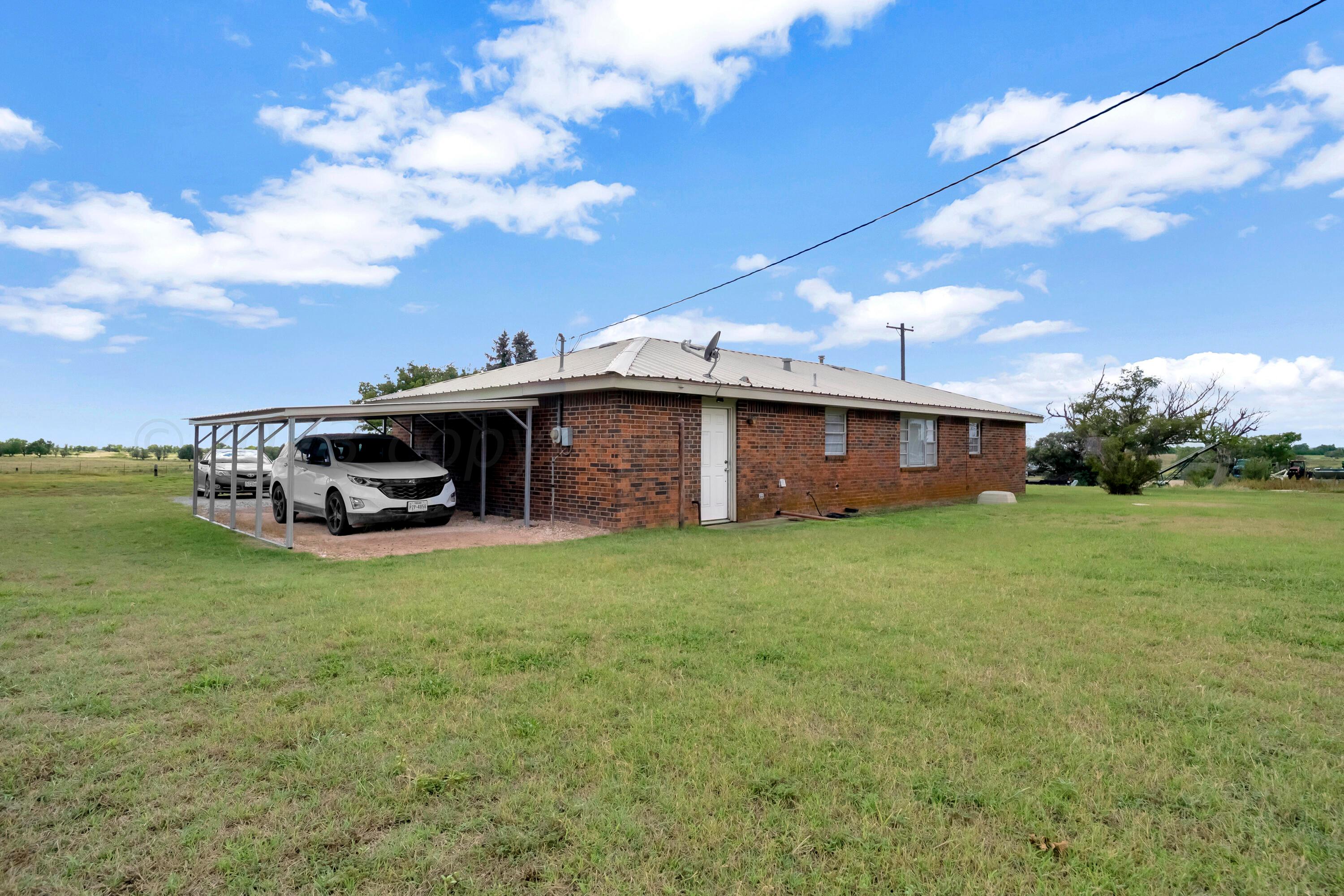 200 West Santa Fe Street Allison, TX 79003 - Photo 25 of 32 a front view of a house with garden