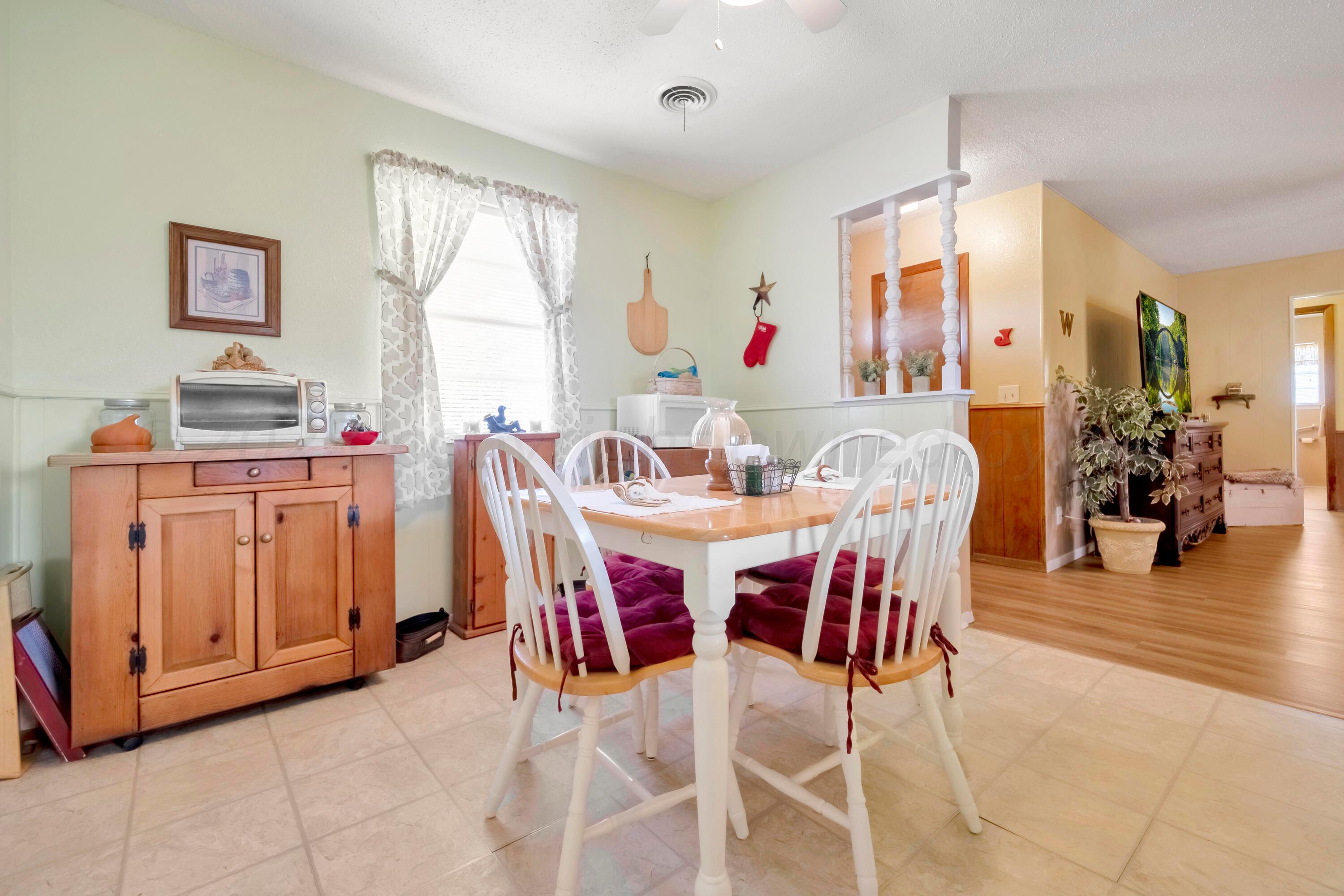 200 West Santa Fe Street Allison, TX 79003 - Photo 9 of 32 a view of a dining room with furniture and window