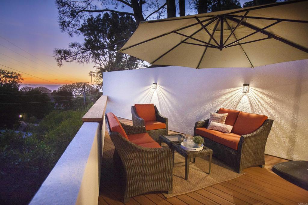 an outdoor space with lounge chair