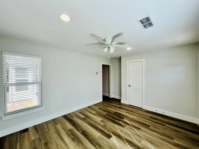 a view of an empty room and window