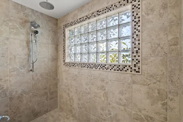 a bedroom with a bed and a view of kitchen
