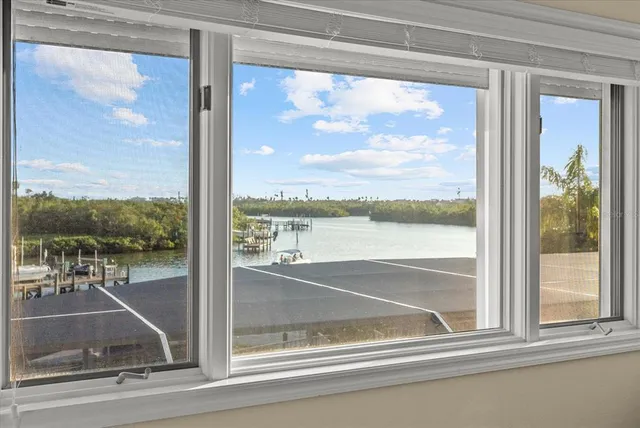 a swimming pool with outdoor seating and garden