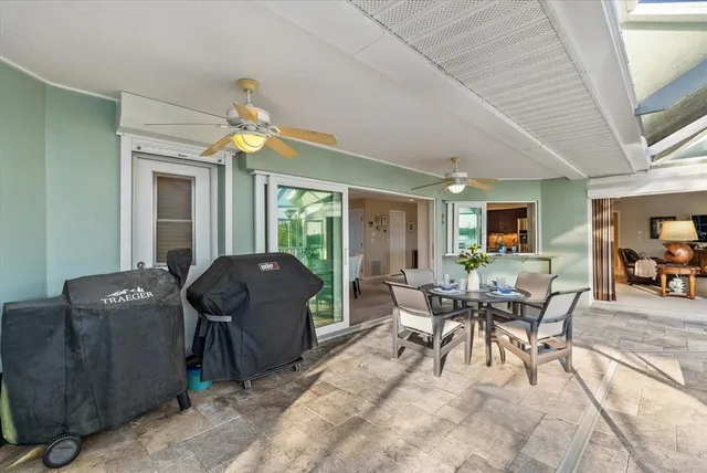an aerial view of residential houses with outdoor space and ocean view
