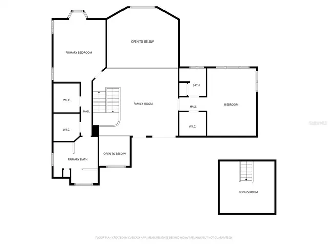 a living room with furniture a fireplace and a large window