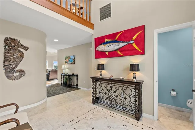 a large kitchen with stainless steel appliances granite countertop a stove and a large refrigerator