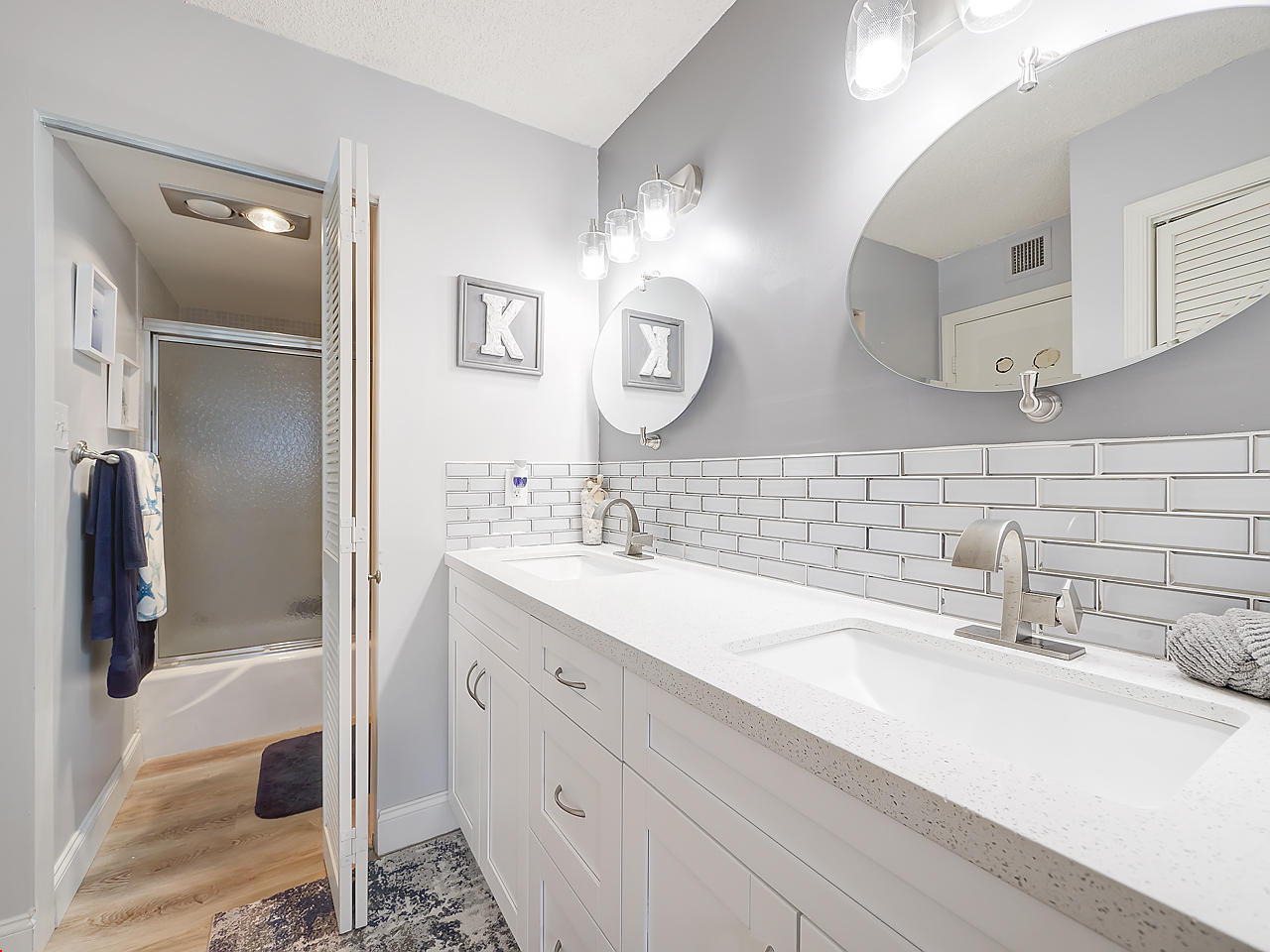 5380 North Ocean Drive, Unit 2E Singer Island, FL 33404 - Photo 15 of 30 a bathroom with double vanity sink and two mirror