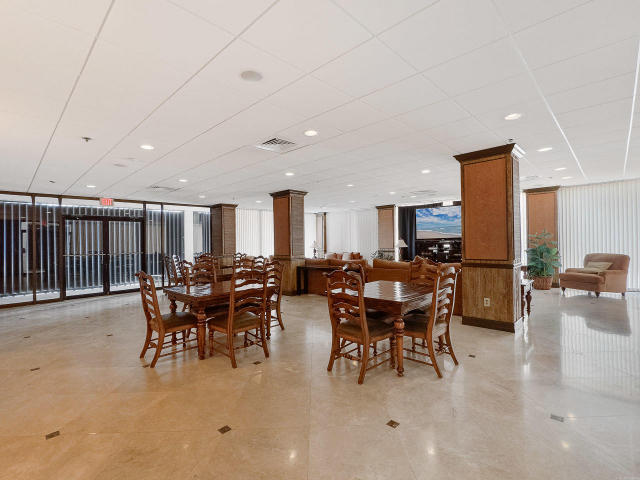 5380 North Ocean Drive, Unit 2E Singer Island, FL 33404 - Photo 25 of 30 a view of a dining room with furniture