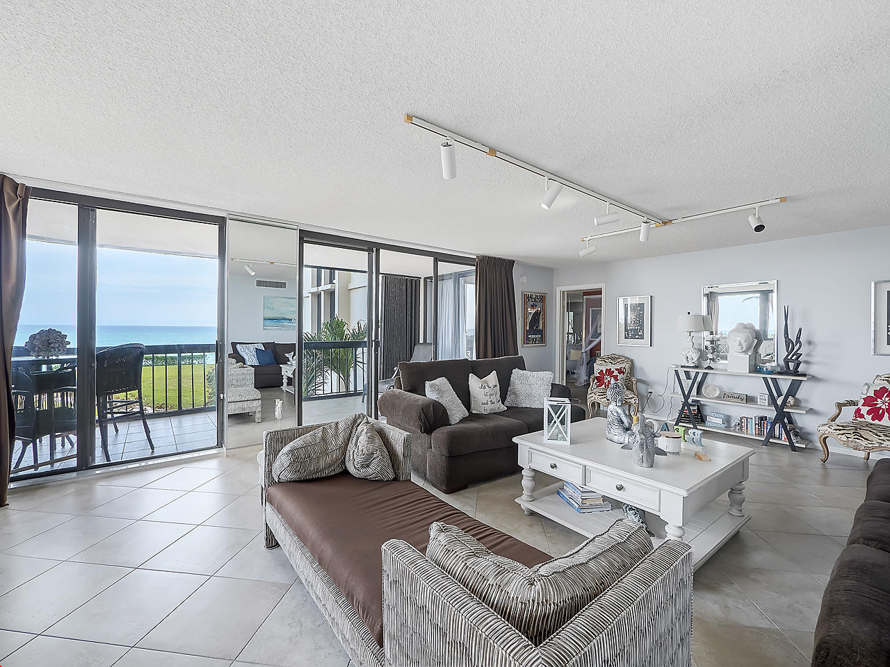 5380 North Ocean Drive, Unit 2E Singer Island, FL 33404 - Photo 5 of 30 a living room with furniture and a floor to ceiling window
